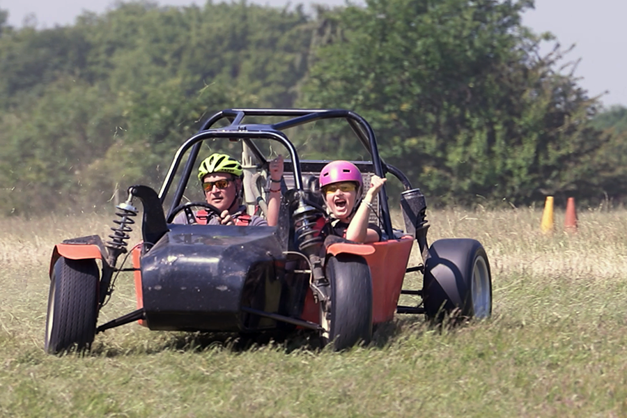 A kid enjoying a Junior Driving Day in a drift car