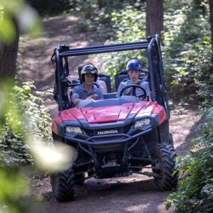 Driving a Honda Pioneer UTV on the woodland trails in Offam, Kent