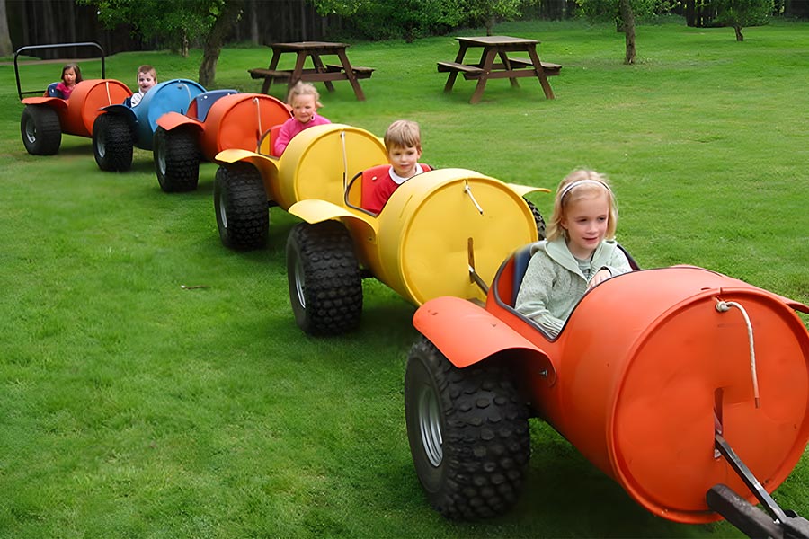 Kids in barrel train cars